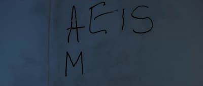 a close up of a writing on a wall