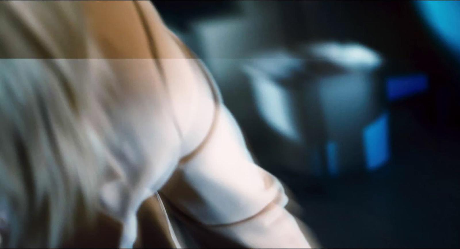 a blurry photo of a woman in a white dress