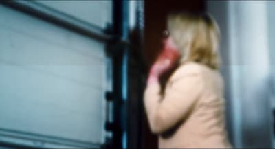 a blurry photo of a woman talking on a cell phone