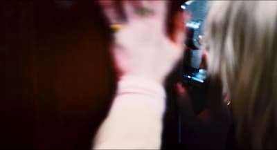 a blurry photo of a person holding a cell phone