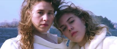 two young women standing next to each other