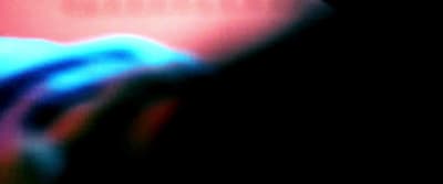 a blurry image of a person holding a cell phone