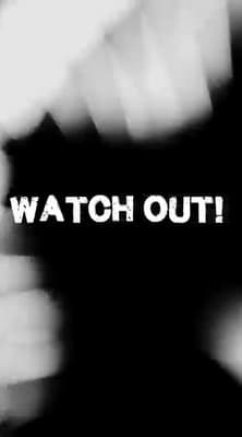 a blurry photo with the words watch out