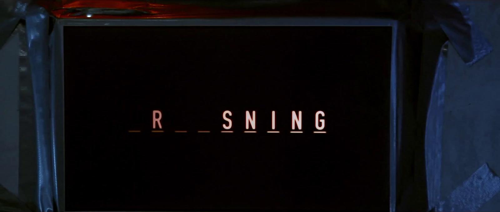 a black box with the word r - sning on it