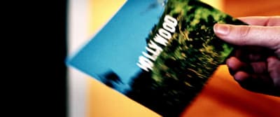 a person holding a book in their hand