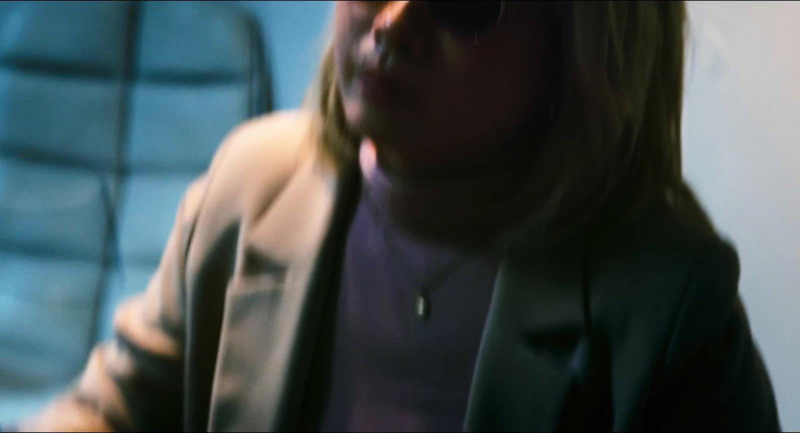 a blurry photo of a woman with a cell phone