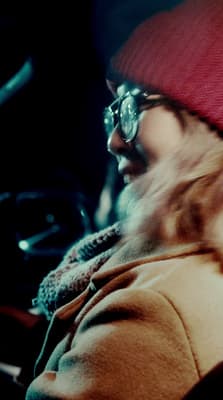 a man wearing a red hat and glasses