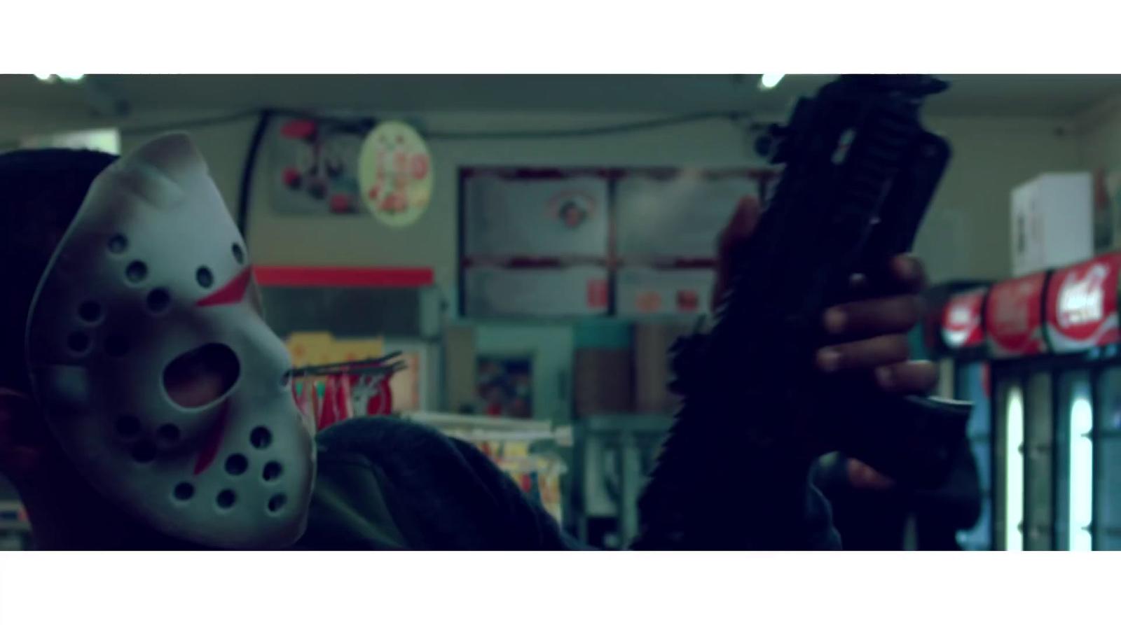 a person wearing a mask holding a gun