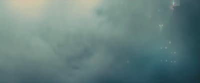 a blurry photo of a building in the sky