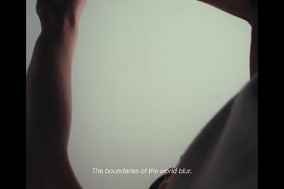 a person holding a cell phone up to their ear
