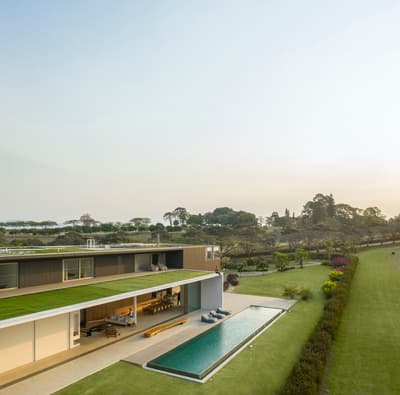 an aerial view of a house with a swimming pool