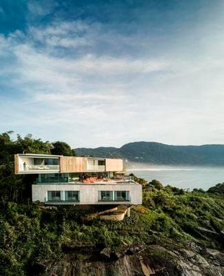 a house on a cliff overlooking the ocean
