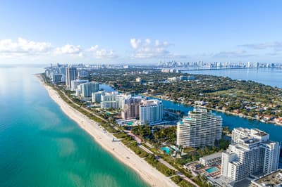 an aerial view of a city and the ocean