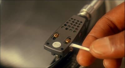 a person holding a cigarette in their left hand