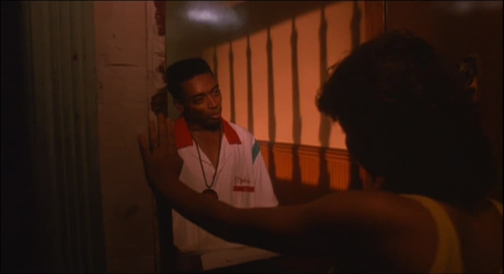 a man standing next to a woman in a room