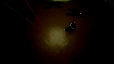 a person on a skateboard in a dark room