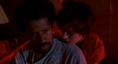 a man and a child in a dark room