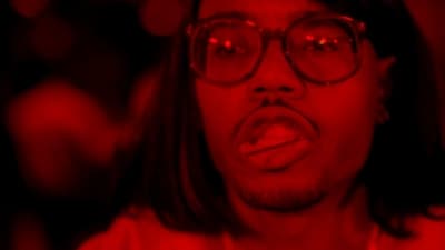 a man with glasses making a surprised face