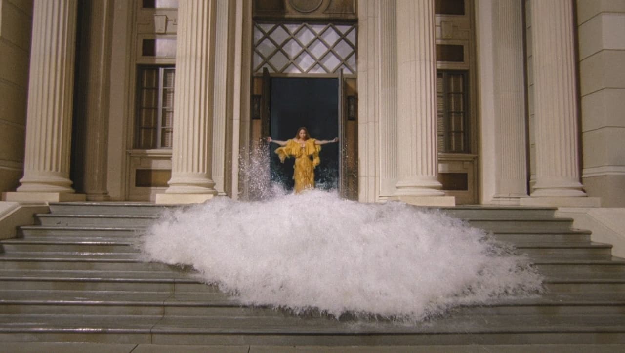 a person standing on a set of stairs in front of a building