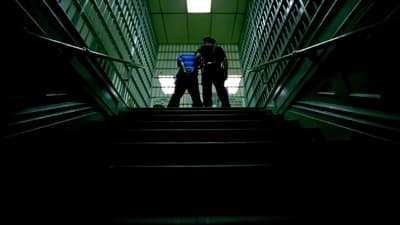 two people walking down a flight of stairs