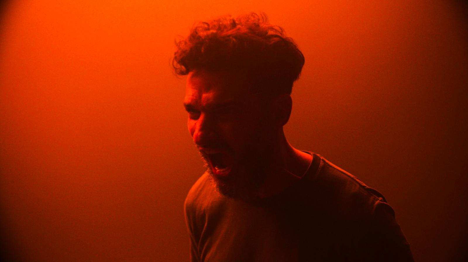 a man making a face with his mouth open