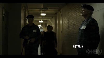 a group of people walking down a hallway