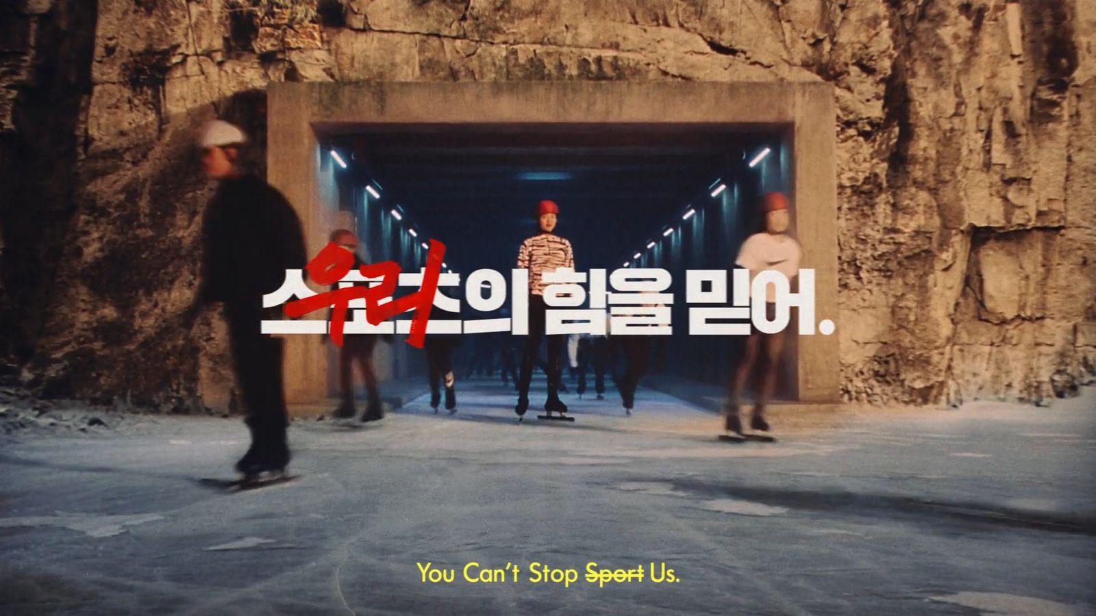 a man riding a skateboard through a tunnel