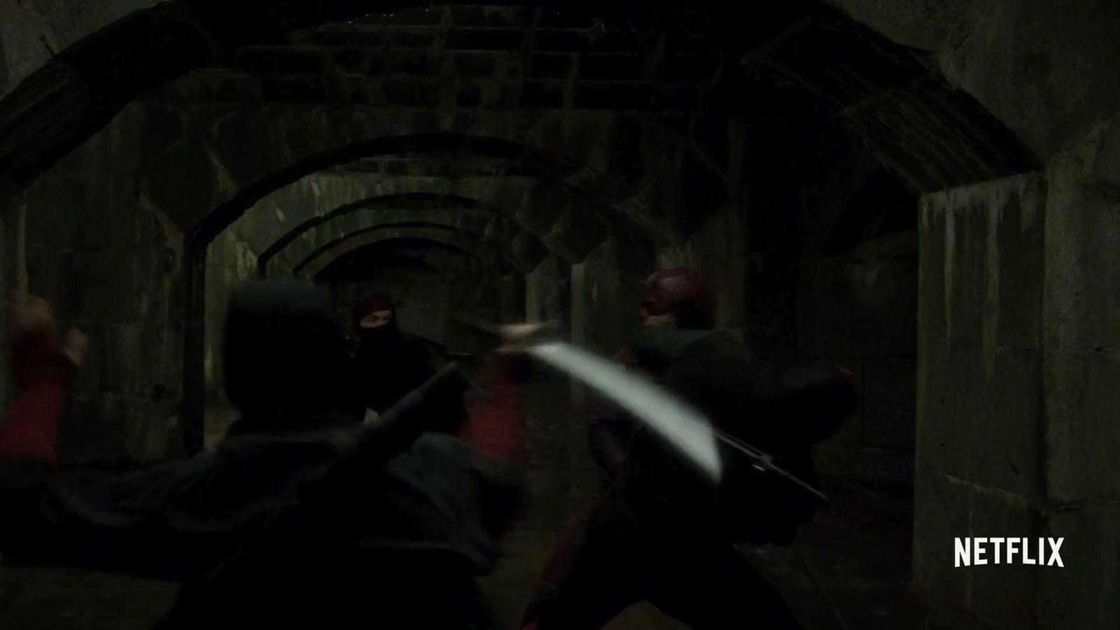 a group of people in a tunnel with a sword