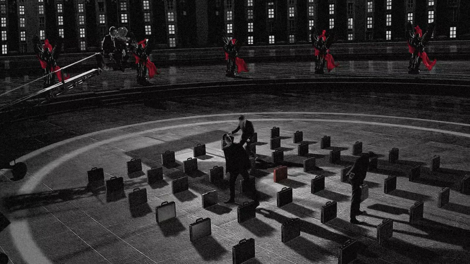 a black and white photo of people in a circle