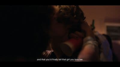 a man drinking from a red cup with a quote on it