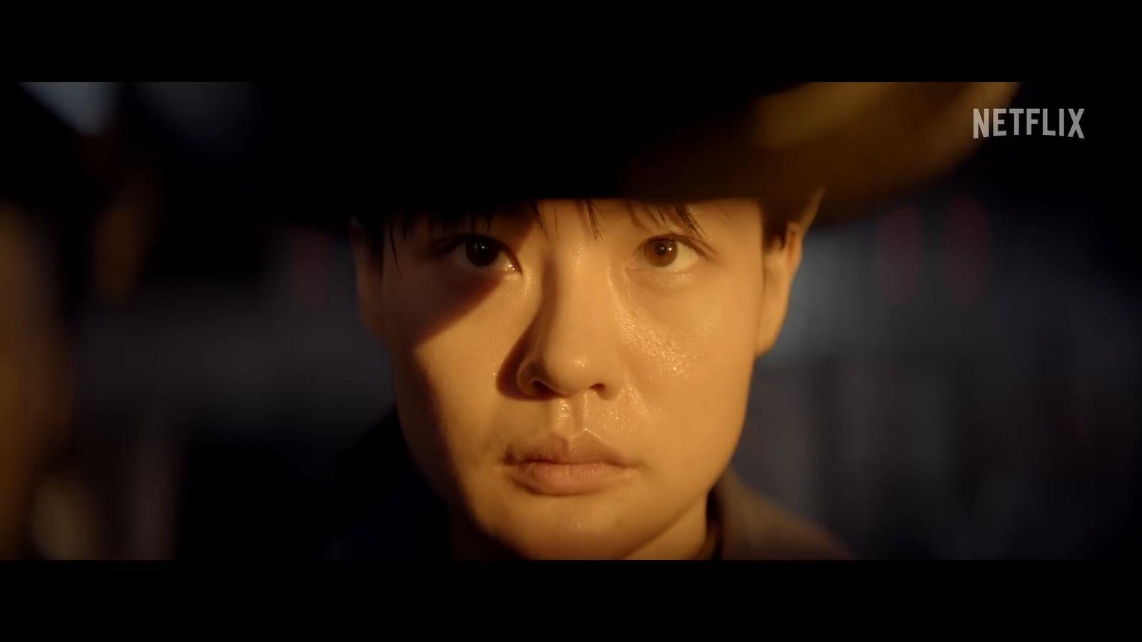 a close up of a person wearing a hat