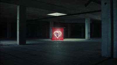 a red box with a heart on it in a dark room