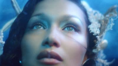 a close up of a woman with blue eyes