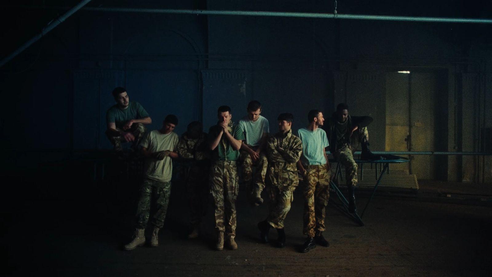 a group of men standing next to each other