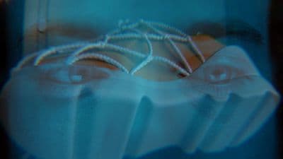 a close up of a person's eye with a pair of eyeglasses