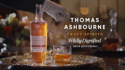 a bottle of whisky sitting on top of a table