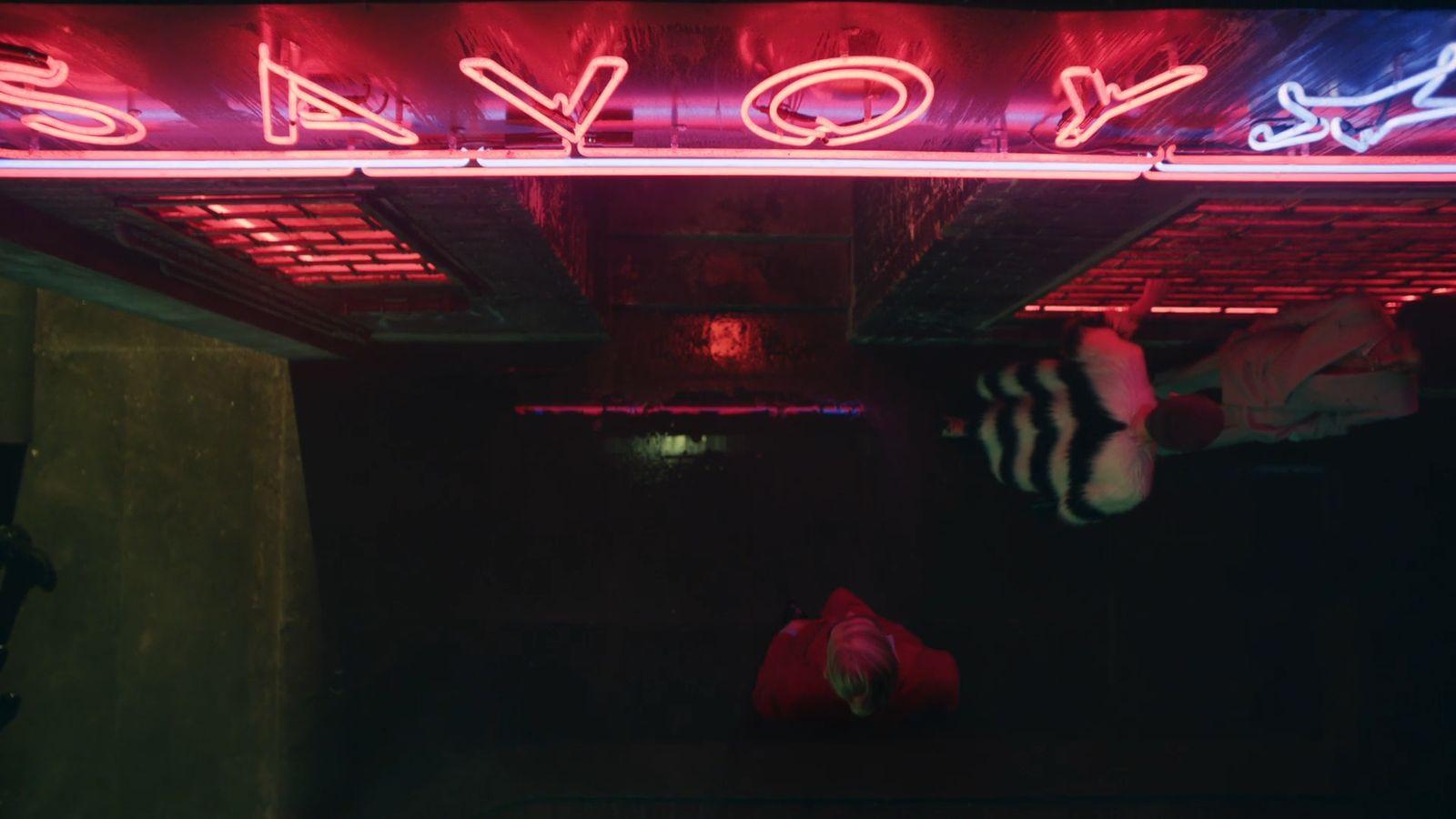 a neon sign that reads savoy on it