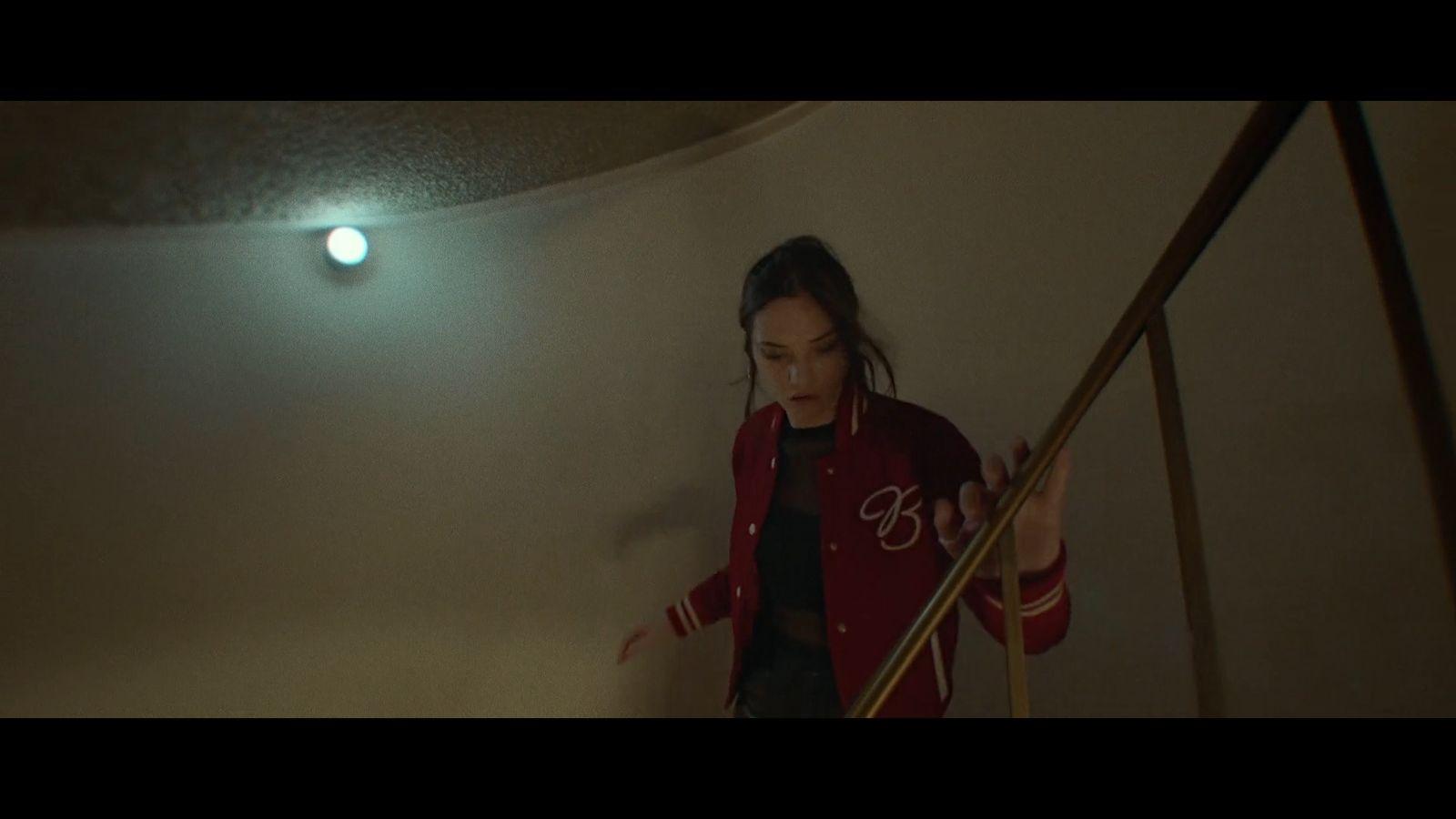 a woman walking up a flight of stairs