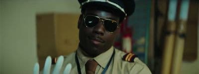 a man in a pilot's uniform and sunglasses