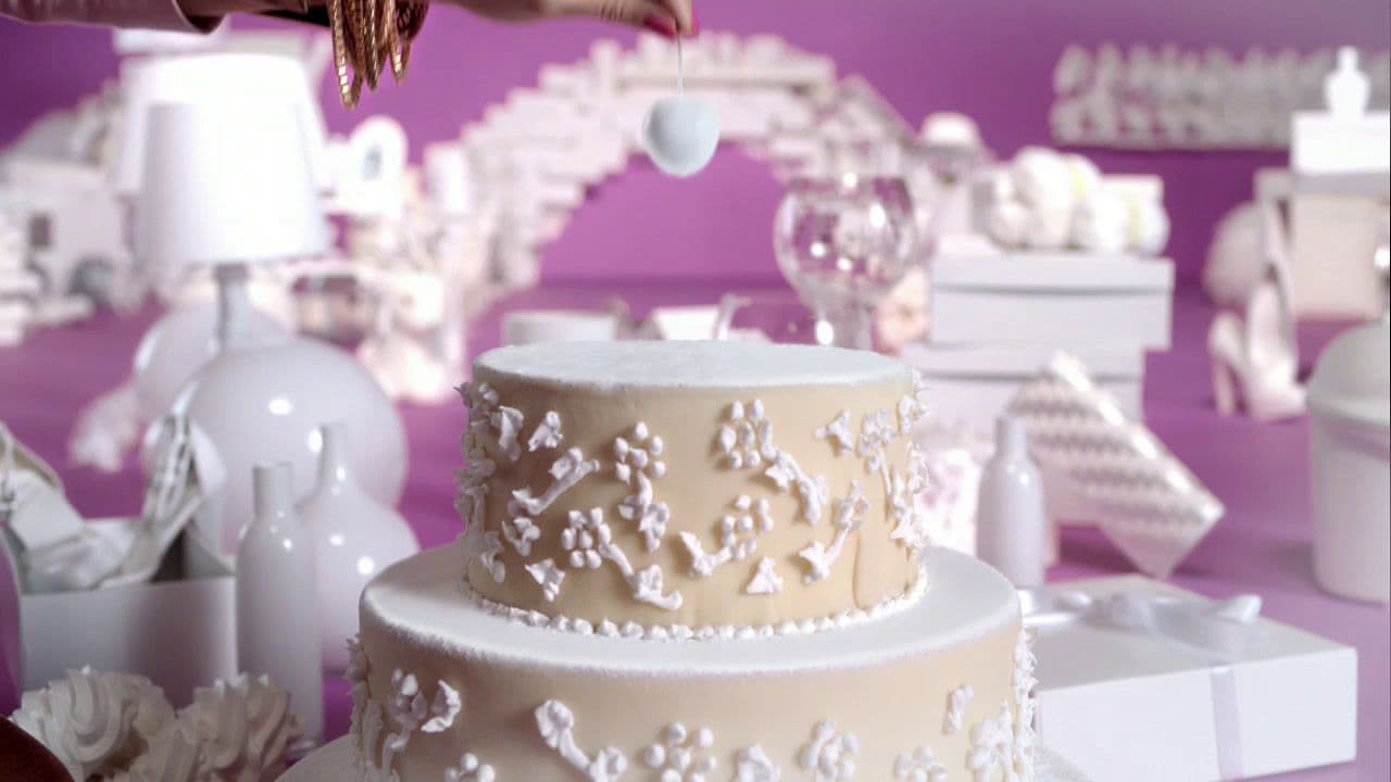 a three tiered cake sitting on top of a table