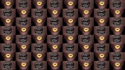 a pattern of chocolates and bananas on a black background