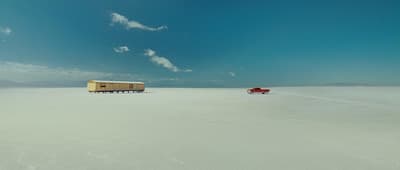 a couple of trailers that are sitting in the snow