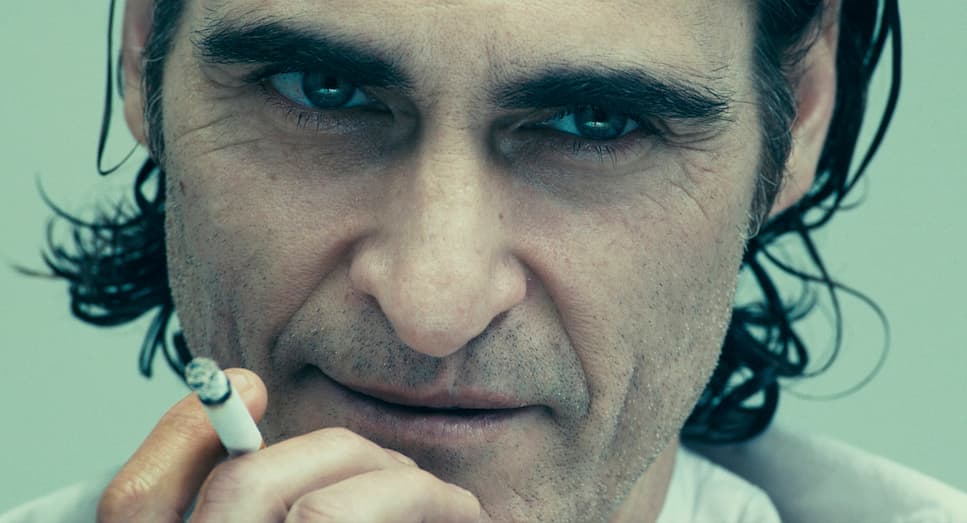 a close up of a person smoking a cigarette