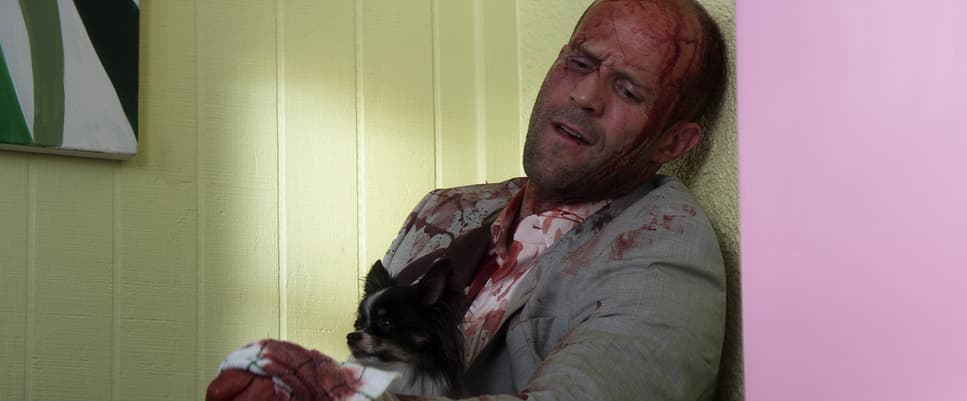 a man with a dog in his arms