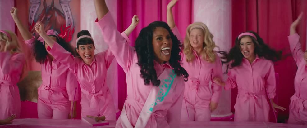 a group of women in pink pajamas posing for a picture