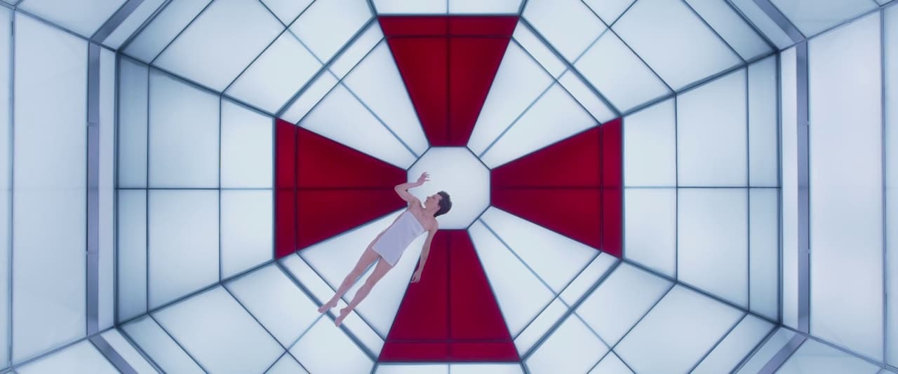 a woman in a white dress is standing in a red and white room