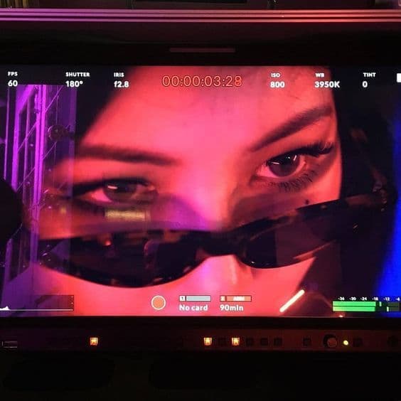 a close up of a monitor with a woman's face