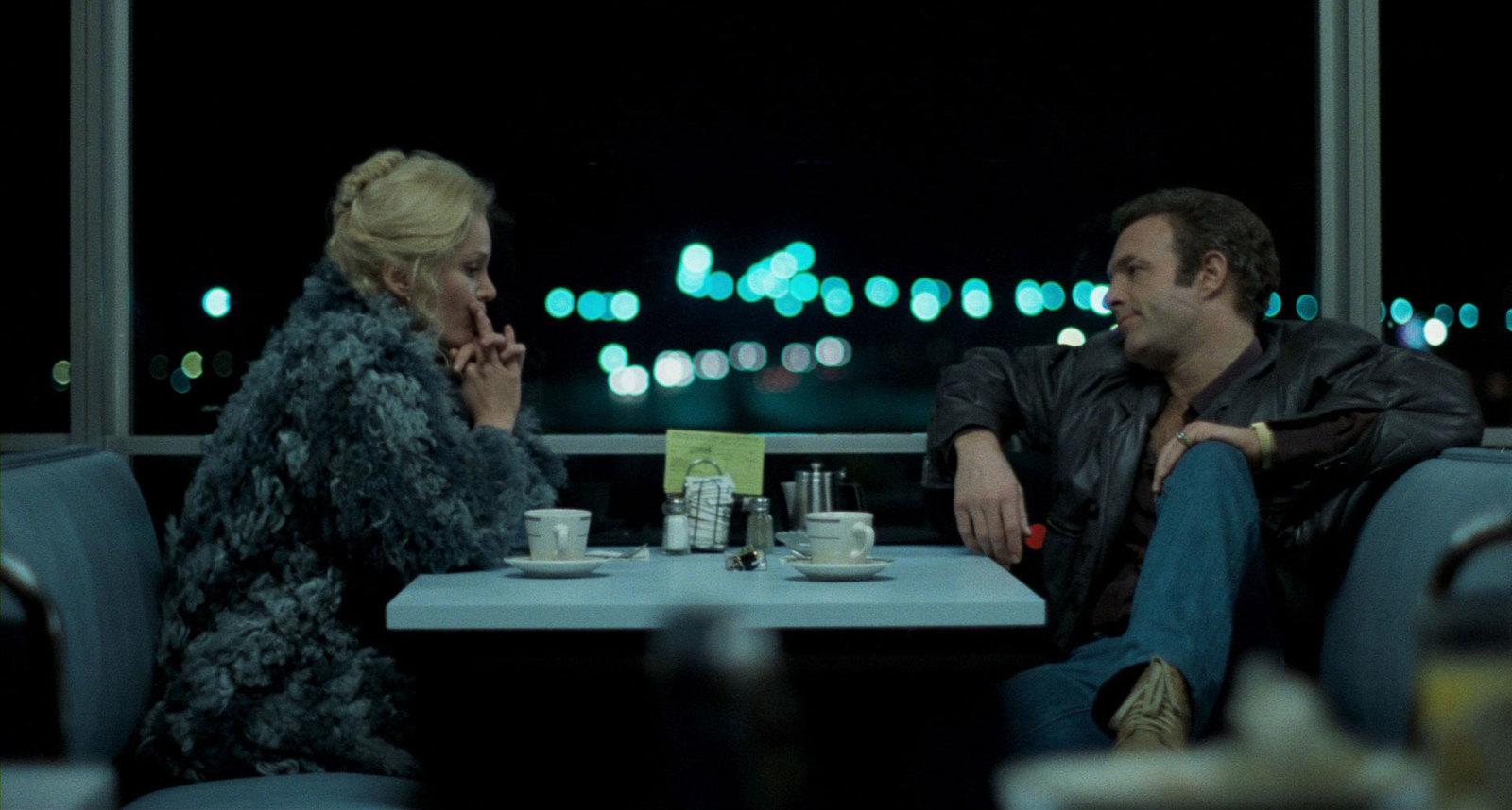 a man and a woman sitting at a table