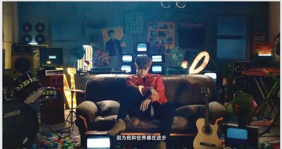 a person sitting on a couch in a room