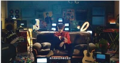a person sitting on a couch in a room